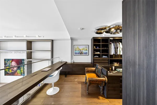 a kitchen with stainless steel appliances kitchen island granite countertop a stove and a refrigerator
