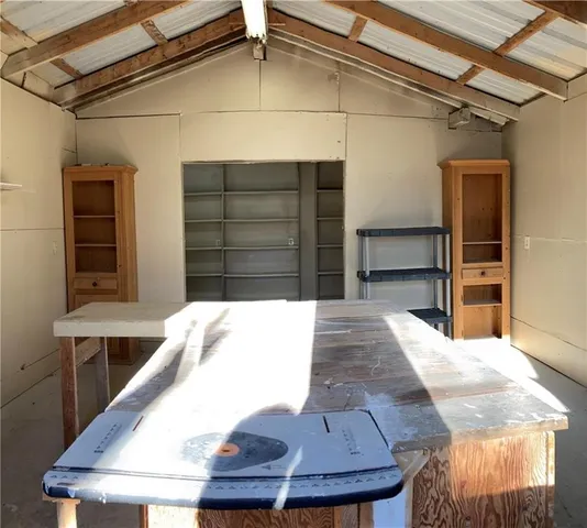 an empty room with a empty space and a ceiling fan