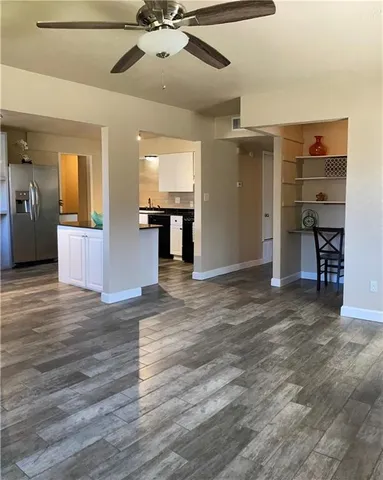 a kitchen with a refrigerator and a stove