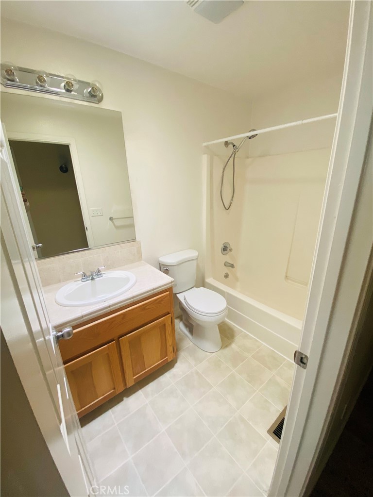 16506 Ridgecrest Court Hidden Valley Lake, CA 95467 - Photo 17 of 25 a bathroom with a granite countertop sink toilet and shower