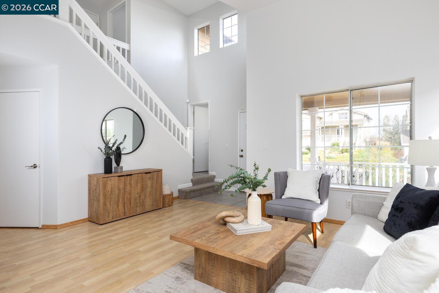 558 Fletcher Street Bay Point, CA 94565 - Photo 11 of 37 a living room with furniture and a wooden floor