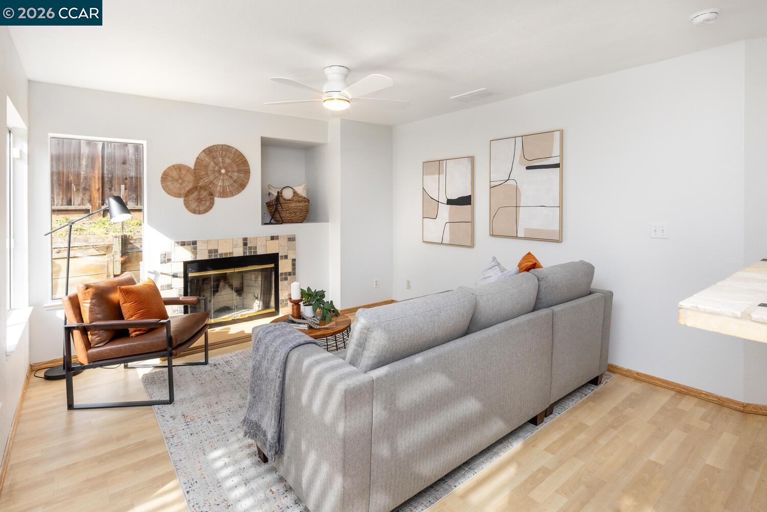 558 Fletcher Street Bay Point, CA 94565 - Photo 14 of 37 a living room with furniture a fireplace and a large window