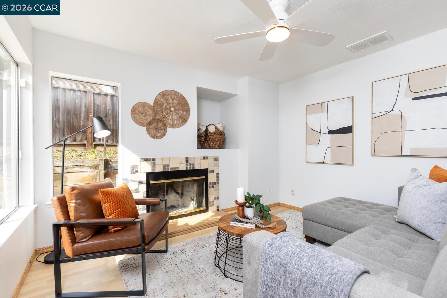558 Fletcher Street Bay Point, CA 94565 - Photo 15 of 37 a living room with furniture a fireplace and a large mirror