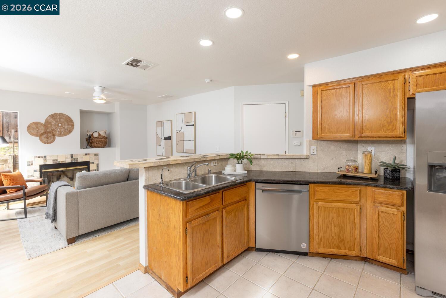 558 Fletcher Street Bay Point, CA 94565 - Photo 19 of 37 a kitchen with a sink stove and cabinets