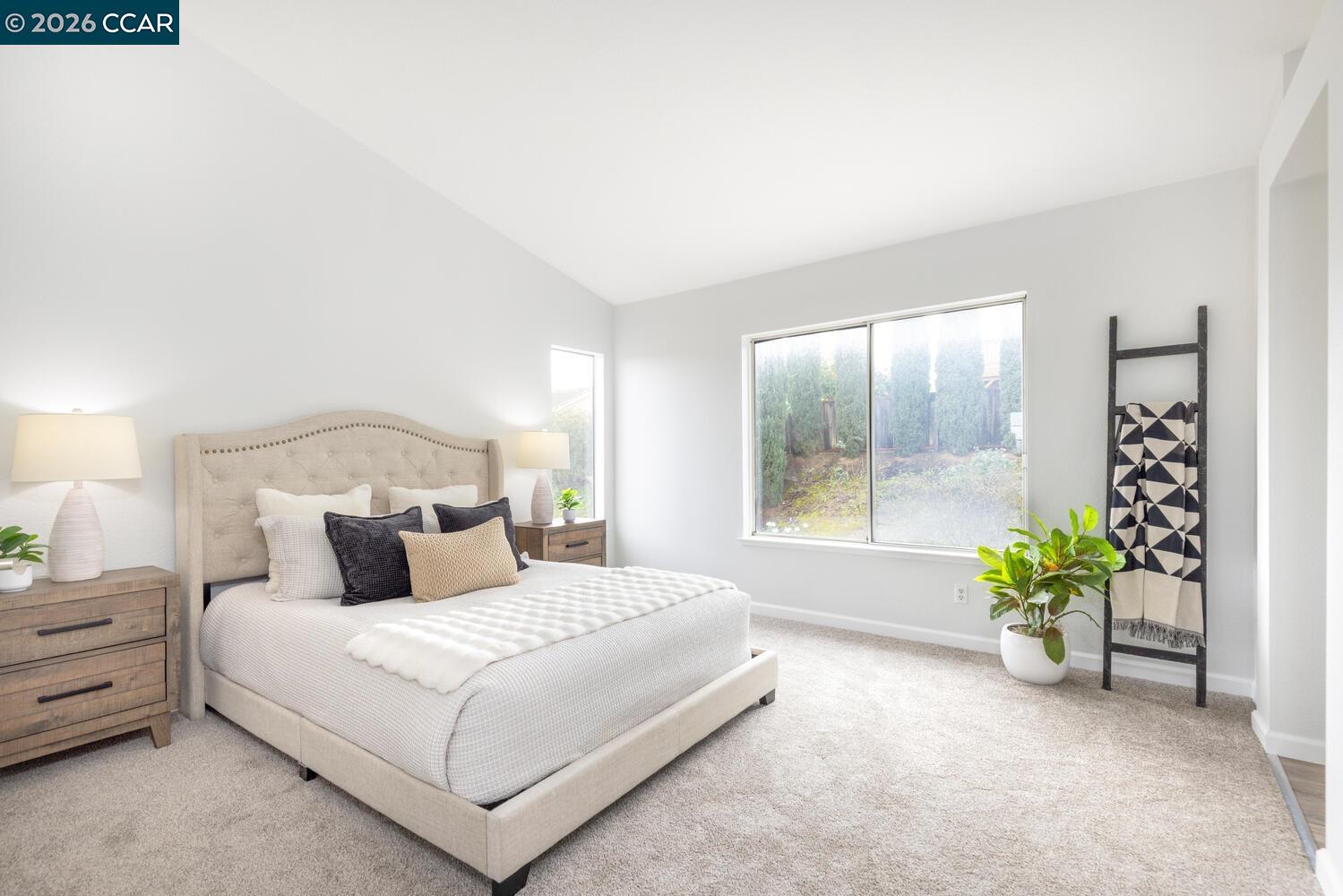 558 Fletcher Street Bay Point, CA 94565 - Photo 24 of 37 a bedroom with a bed and a potted plant