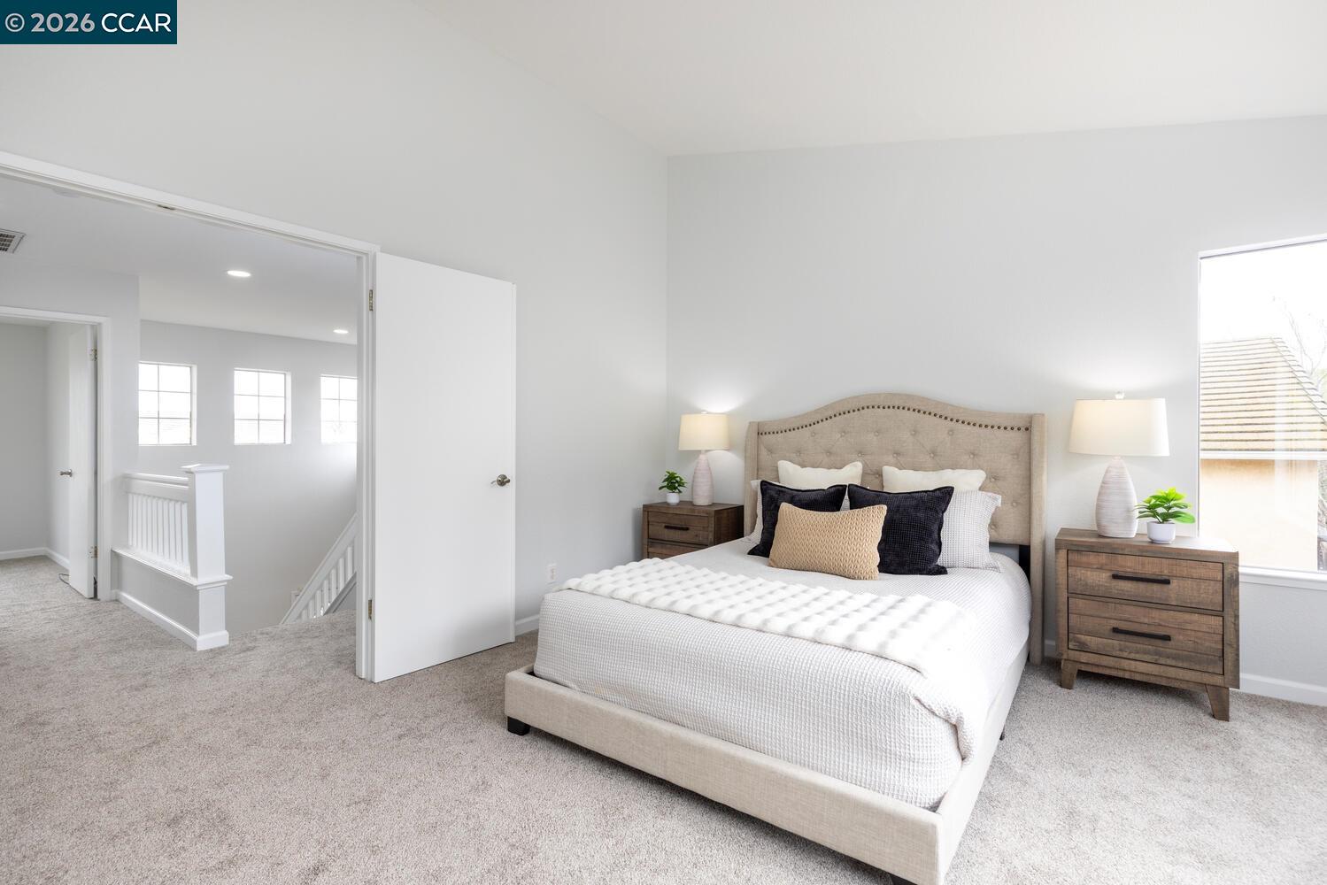 558 Fletcher Street Bay Point, CA 94565 - Photo 25 of 37 a bedroom with a bed and a lamp