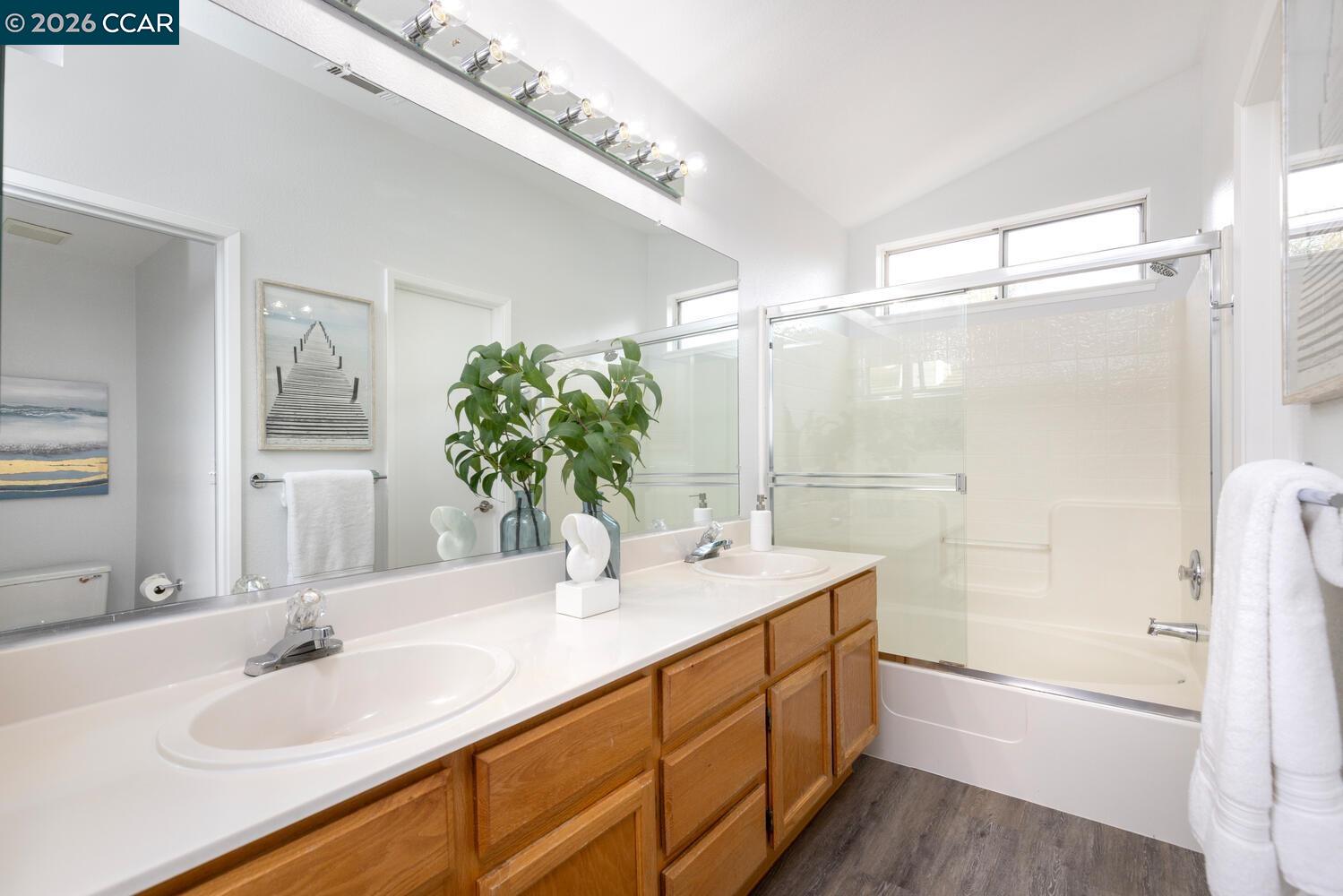 558 Fletcher Street Bay Point, CA 94565 - Photo 27 of 37 a bathroom with a double vanity sink mirror and shower