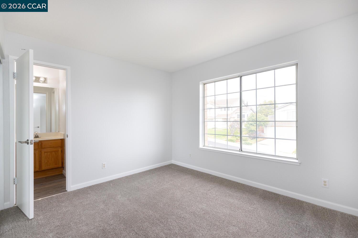 558 Fletcher Street Bay Point, CA 94565 - Photo 28 of 37 an empty room with a window and a bathroom