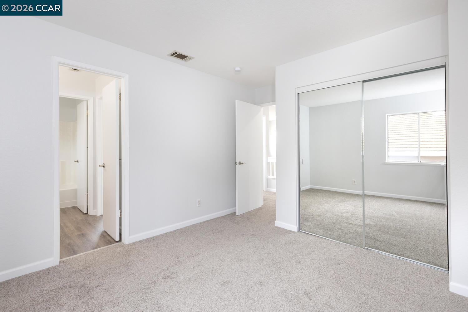 558 Fletcher Street Bay Point, CA 94565 - Photo 31 of 37 an empty room with windows and closet