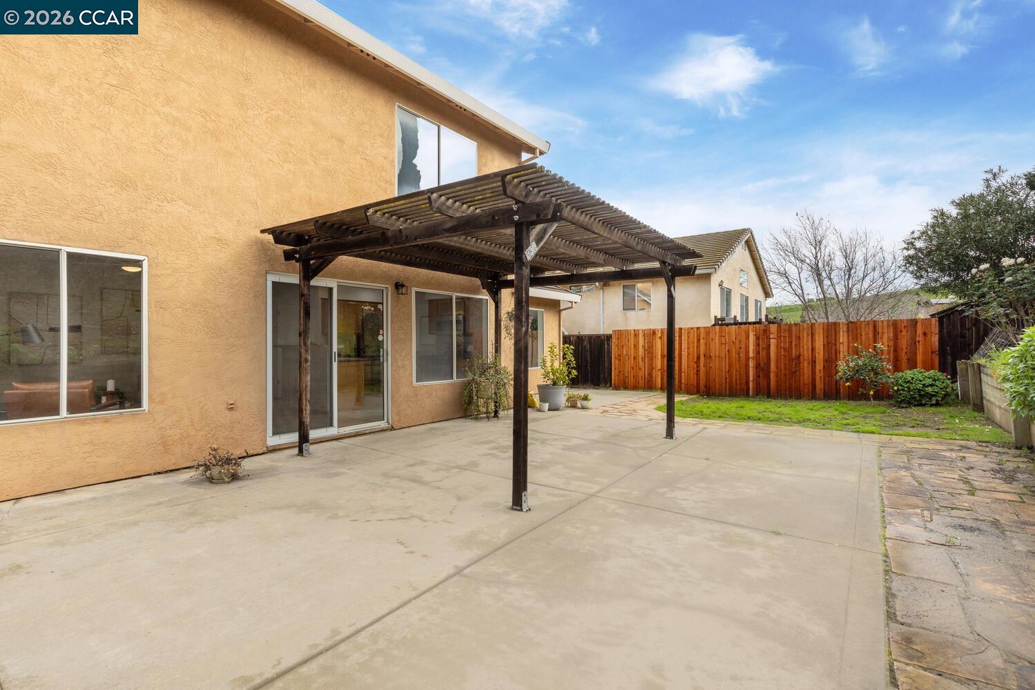 558 Fletcher Street Bay Point, CA 94565 - Photo 34 of 37 a view of a house with backyard and wooden fence