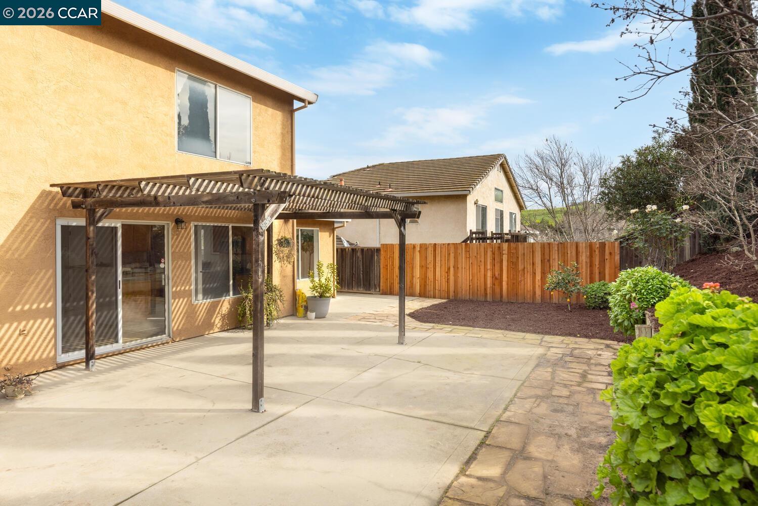 558 Fletcher Street Bay Point, CA 94565 - Photo 35 of 37 a front view of a house with a garden and plants