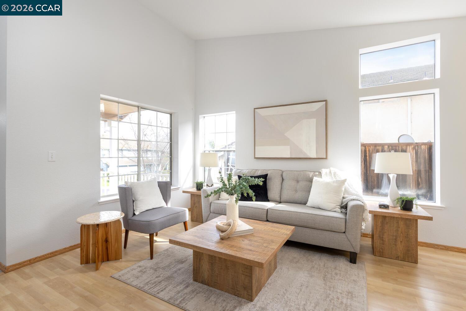 558 Fletcher Street Bay Point, CA 94565 - Photo 9 of 37 a living room with furniture and a large window