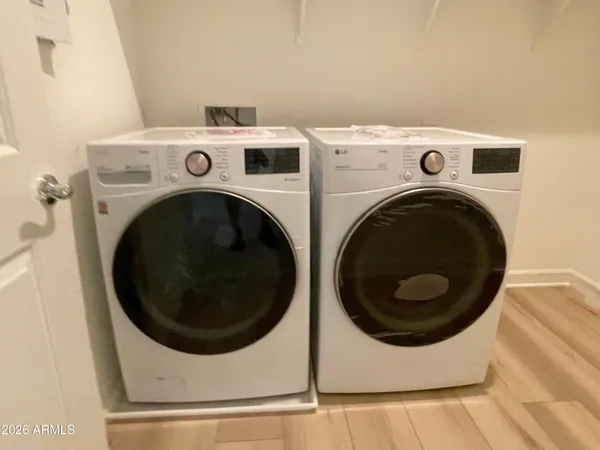 a utility room with dryer and washer