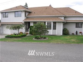 1520 South 9th Street Renton, WA 98057 - Photo 1 of 1 a front view of a house with a garden and plants