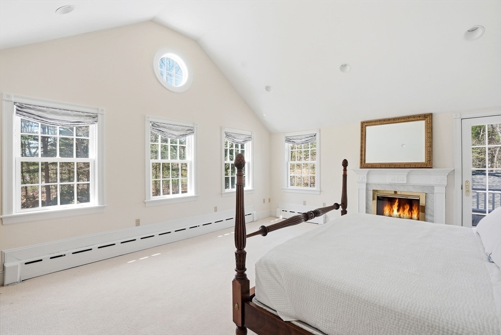 192 Prospect Street Hingham, MA 02043 - Photo 12 of 37 a bed room with a bed and a fireplace