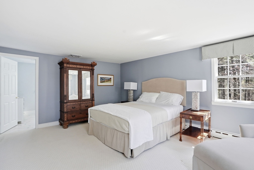 192 Prospect Street Hingham, MA 02043 - Photo 14 of 37 a bedroom with a bed lamp and a window