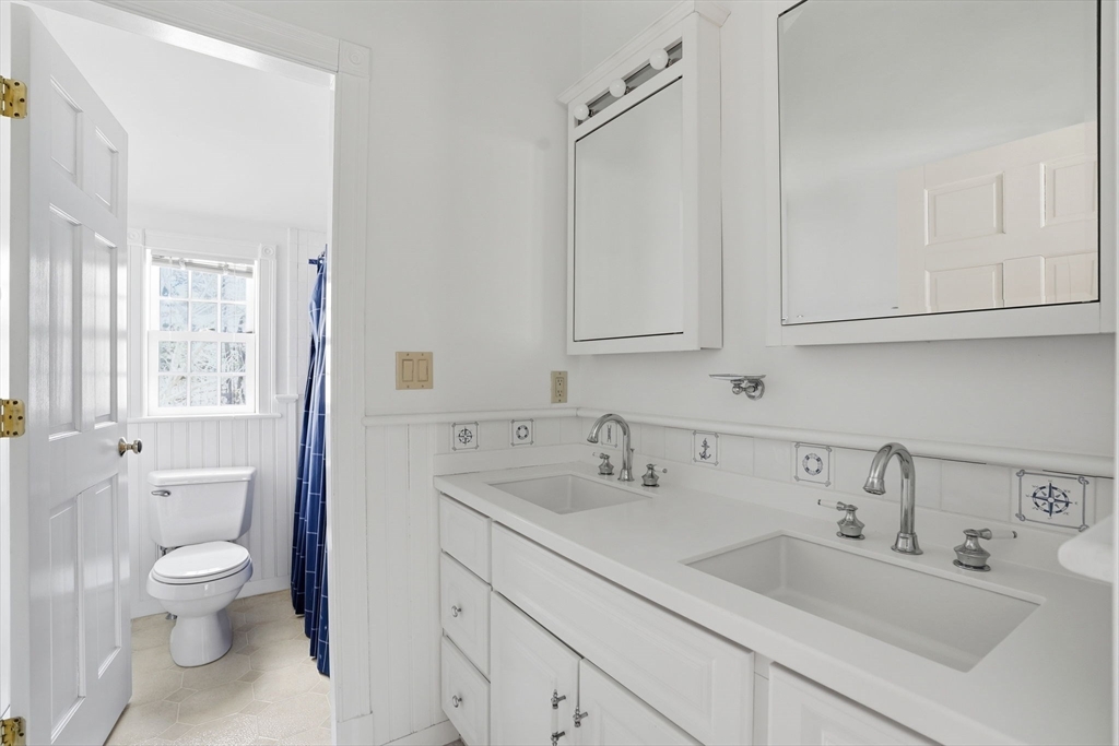 192 Prospect Street Hingham, MA 02043 - Photo 17 of 37 a bathroom with a sink and a toilet