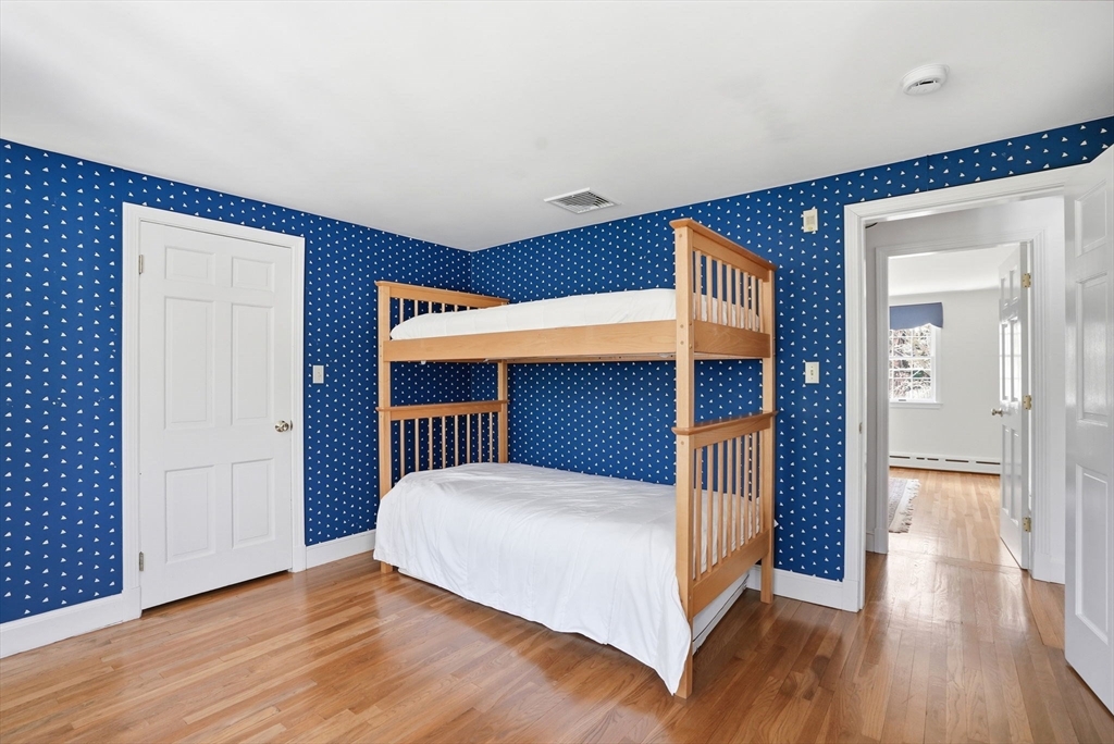 192 Prospect Street Hingham, MA 02043 - Photo 18 of 37 a bedroom with a bed and wooden floor