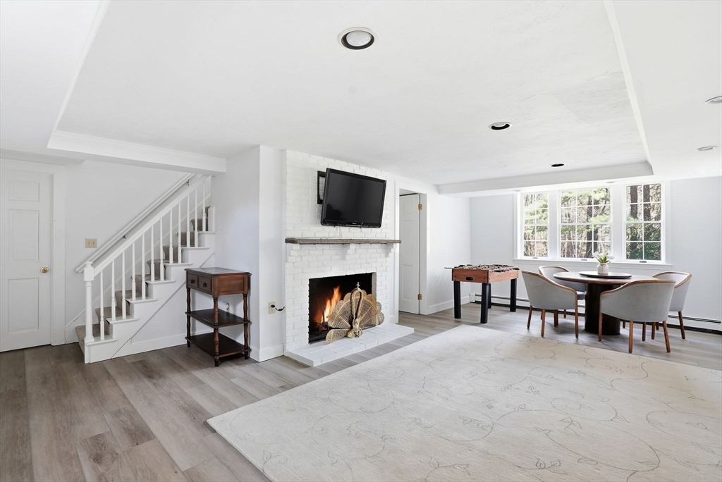 192 Prospect Street Hingham, MA 02043 - Photo 21 of 37 a view of a livingroom with furniture and a fireplace