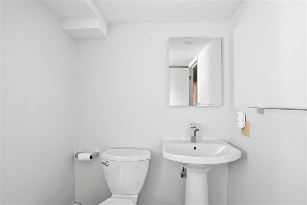192 Prospect Street Hingham, MA 02043 - Photo 23 of 37 a bathroom with a toilet sink and mirror