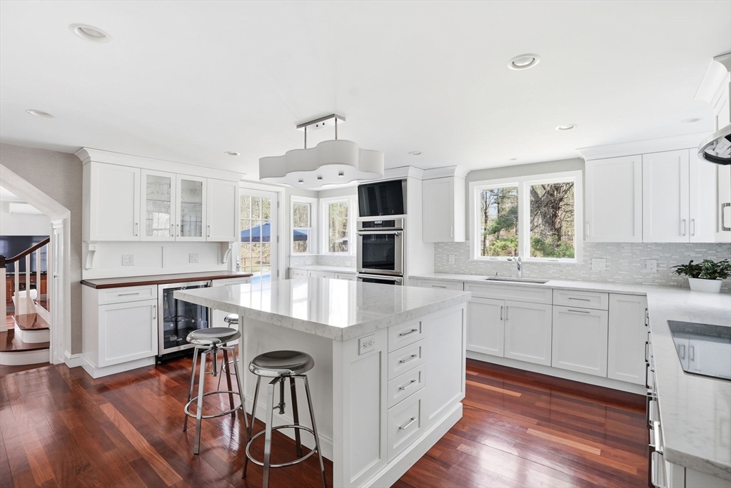 192 Prospect Street Hingham, MA 02043 - Photo 3 of 37 a kitchen with sink cabinets and wooden floor