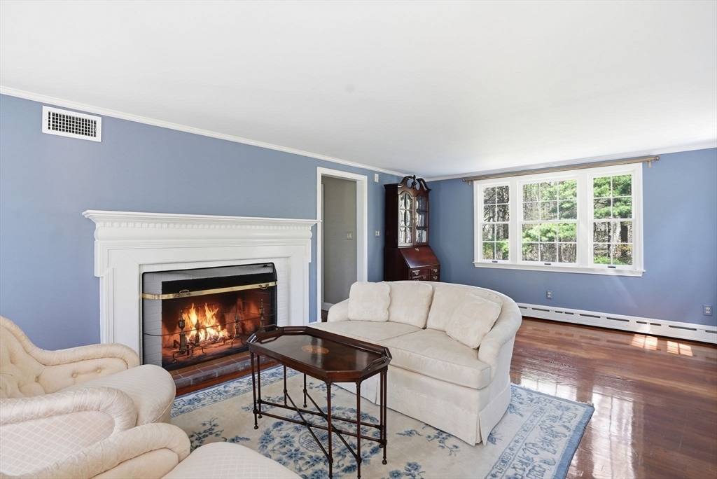 192 Prospect Street Hingham, MA 02043 - Photo 8 of 37 a living room with furniture and a fireplace