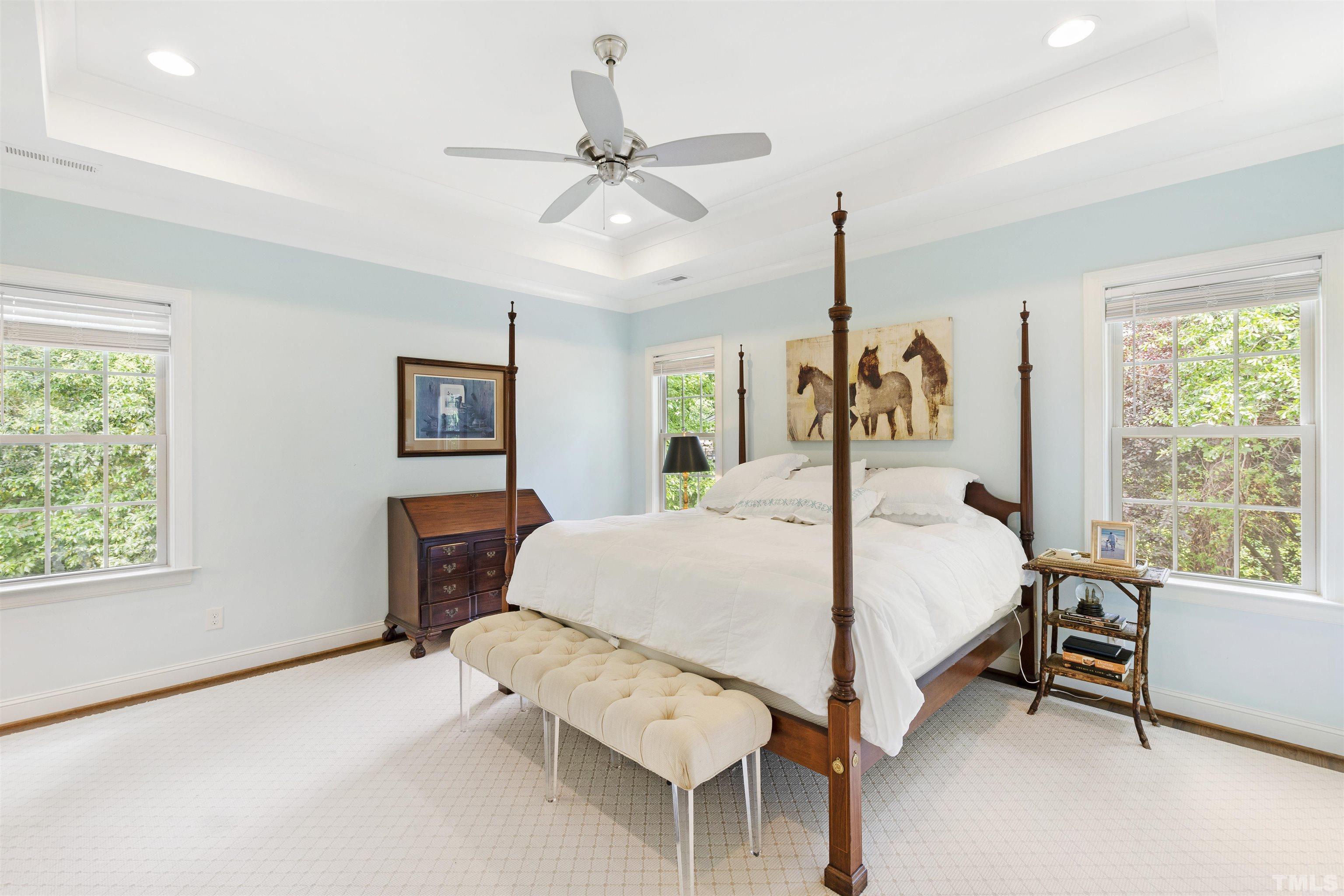 3205 Plantation Road Raleigh, NC 27609 - Photo 16 of 39 a bed room with a bed and a chandelier