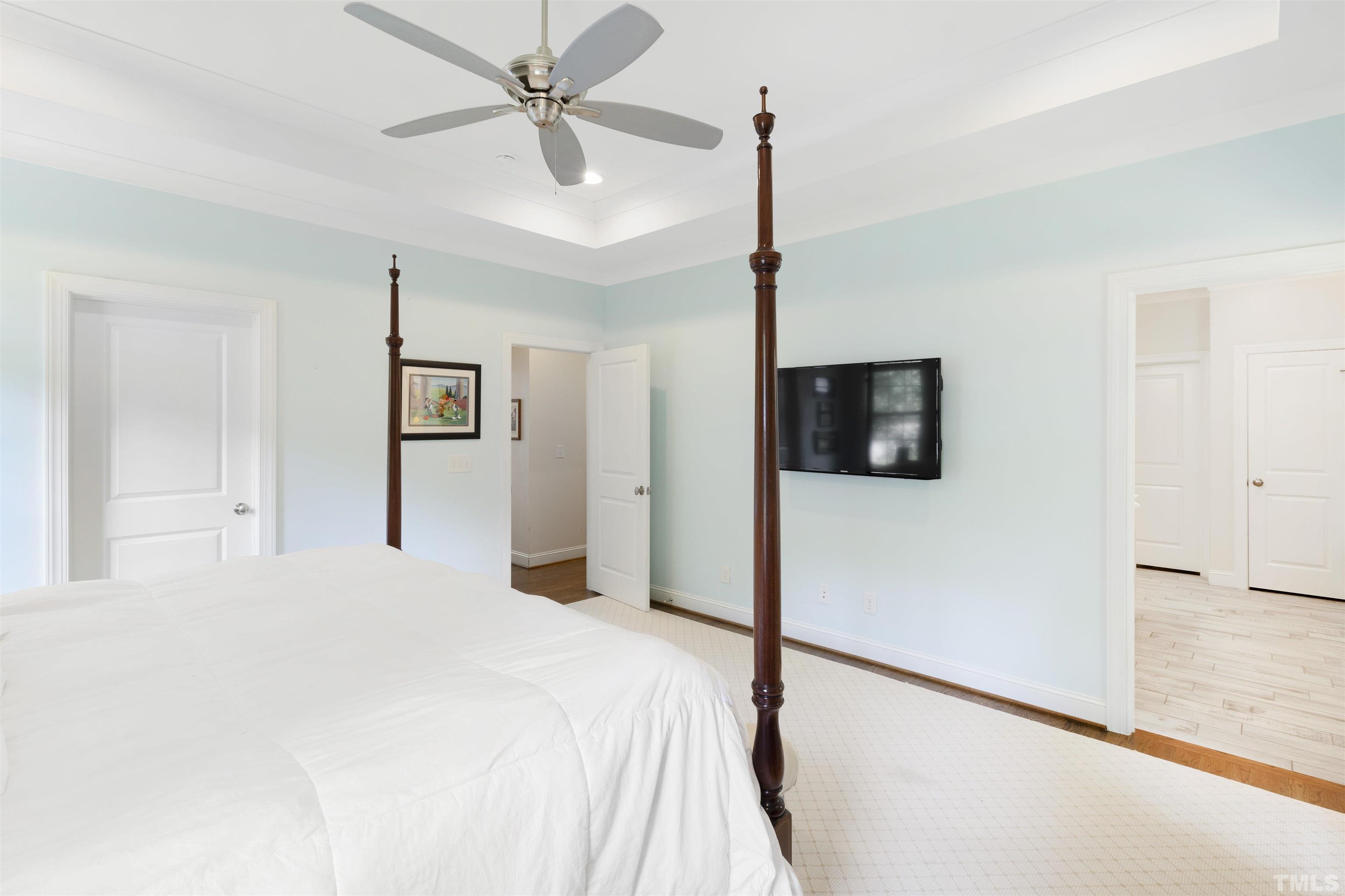 3205 Plantation Road Raleigh, NC 27609 - Photo 17 of 39 a bedroom with a bed and a flat screen tv