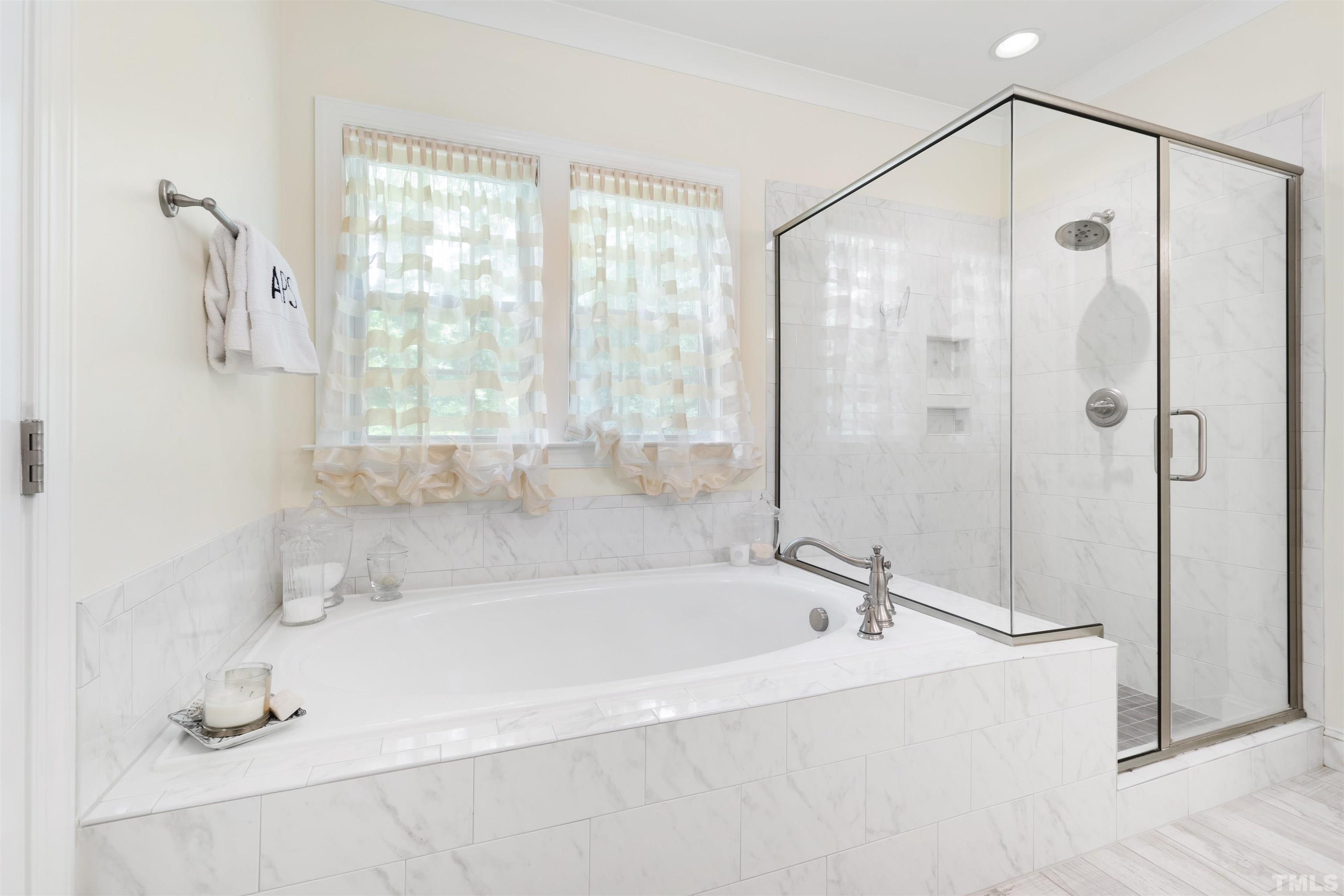 3205 Plantation Road Raleigh, NC 27609 - Photo 18 of 39 a white bath tub sitting next to a shower