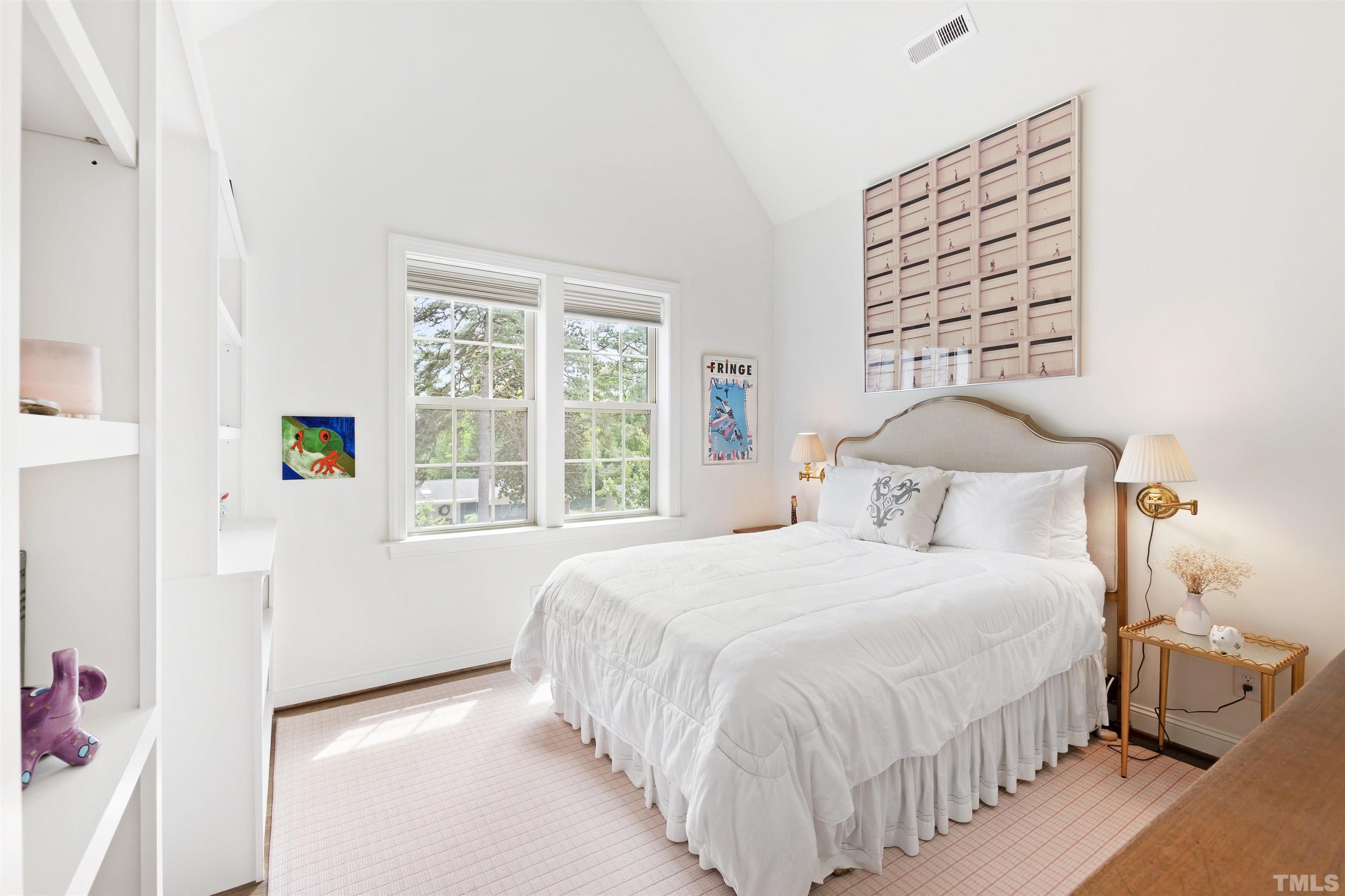 3205 Plantation Road Raleigh, NC 27609 - Photo 20 of 39 a bedroom with a bed and a window