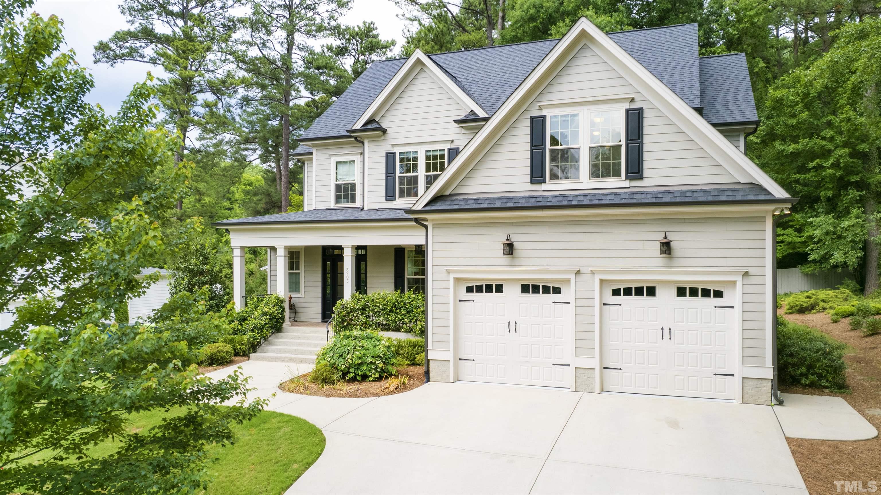3205 Plantation Road Raleigh, NC 27609 - Photo 2 of 39 a view of white house with a yard and potted plants