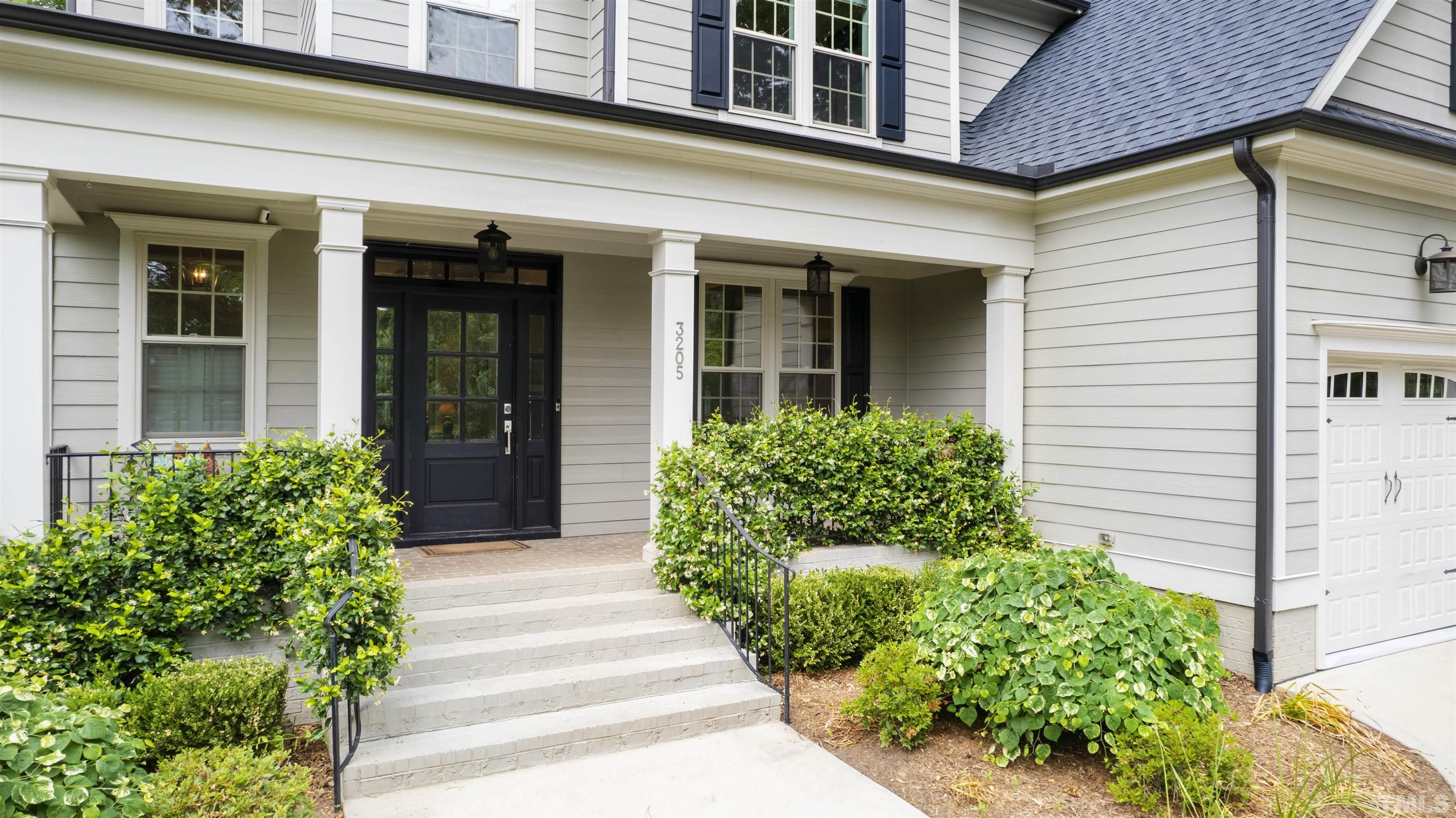 3205 Plantation Road Raleigh, NC 27609 - Photo 3 of 39 a view of a house with potted plants