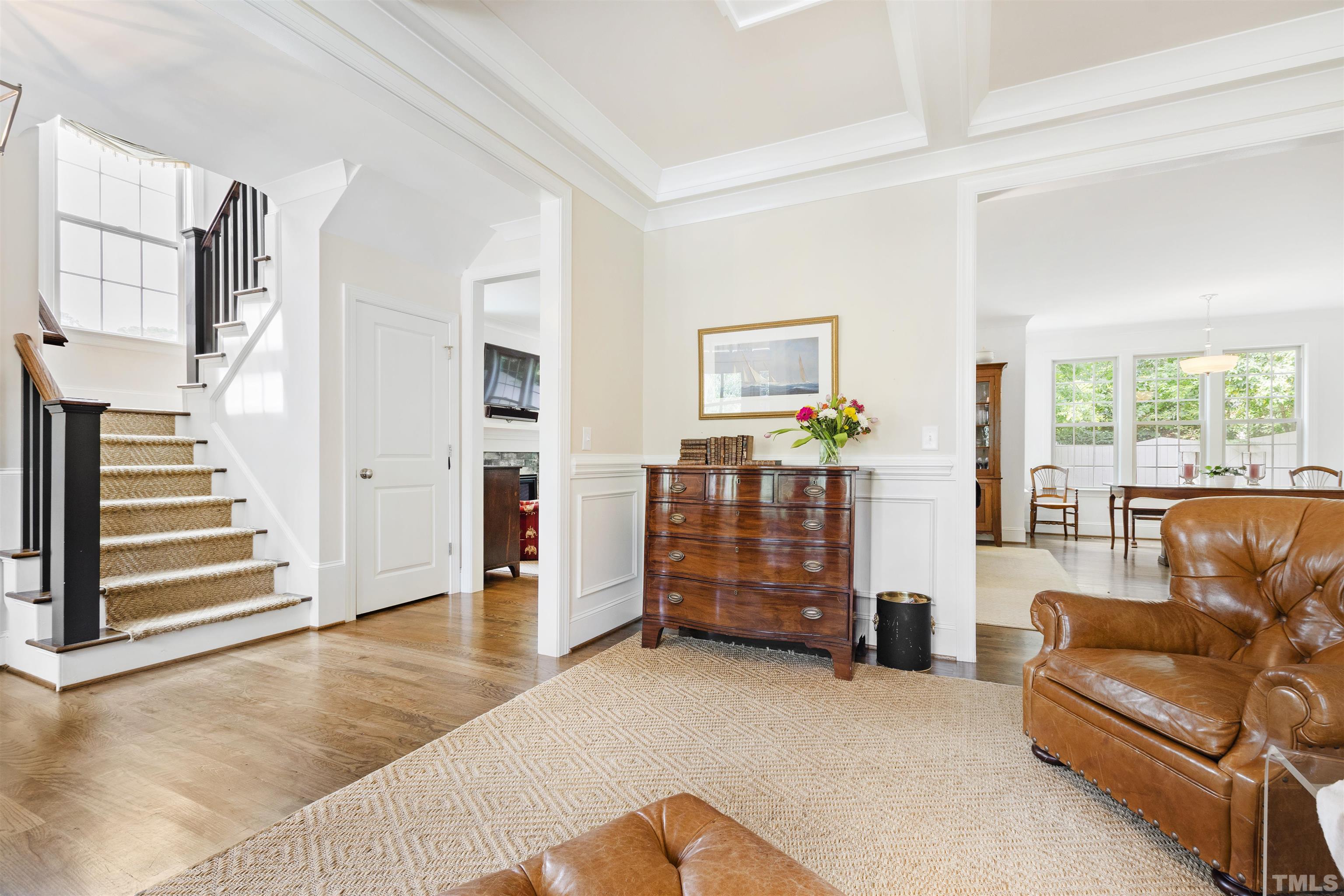 3205 Plantation Road Raleigh, NC 27609 - Photo 6 of 39 a living room with furniture and stairs
