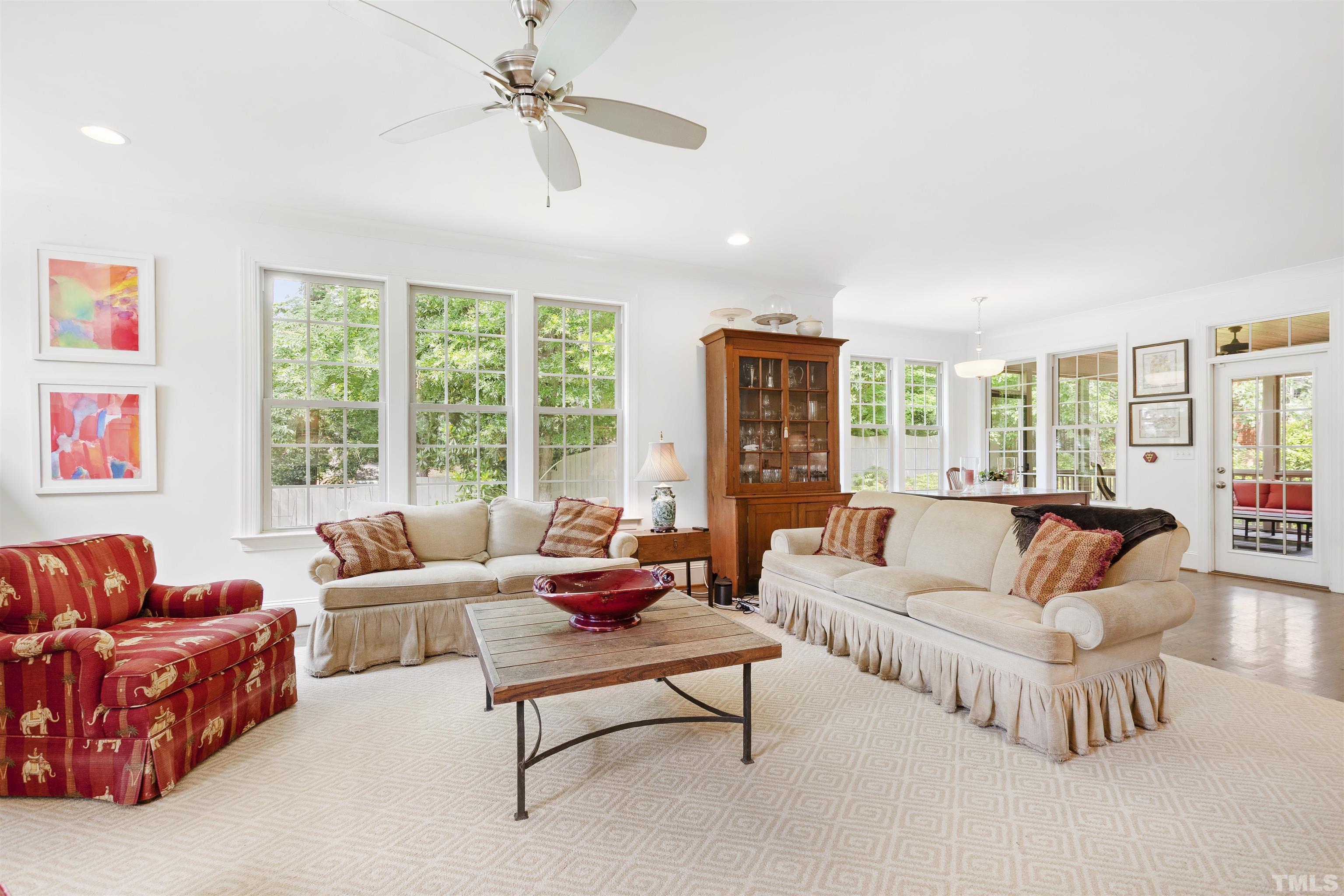 3205 Plantation Road Raleigh, NC 27609 - Photo 9 of 39 a living room with furniture and a large window