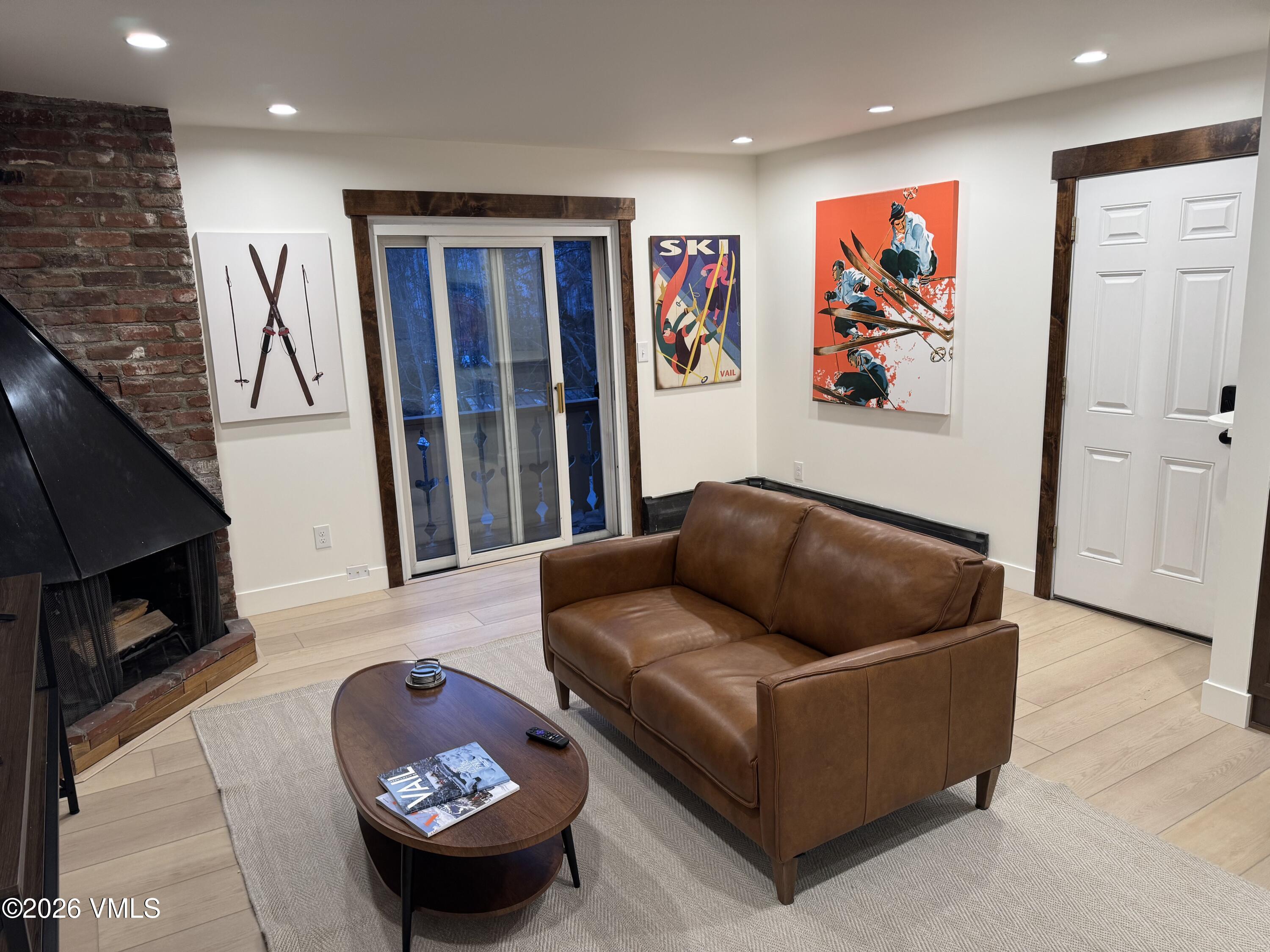 4133 Spruce Way, Unit 6 Vail, CO 81657 - Photo 3 of 11 a living room with furniture and a flat screen tv