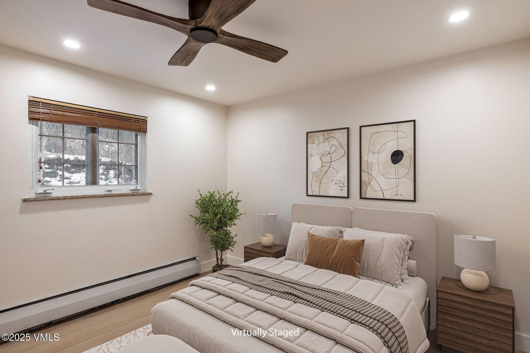 4133 Spruce Way, Unit 6 Vail, CO 81657 - Photo 4 of 11 a bedroom with a bed and a painting on the wall