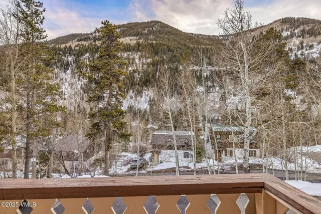 a view of house with mountain view