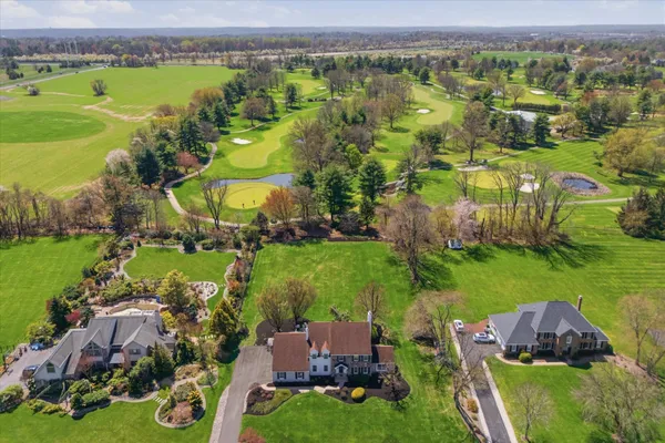 an aerial view of a houses with outdoor space and garden