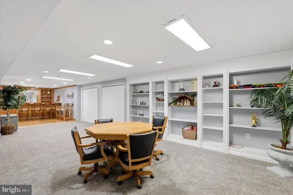 a dining room with a table and chairs