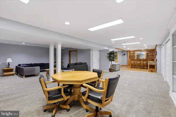 a view of a dining room with furniture and a table