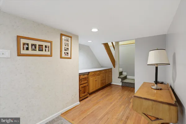 a room with furniture and a wooden floor