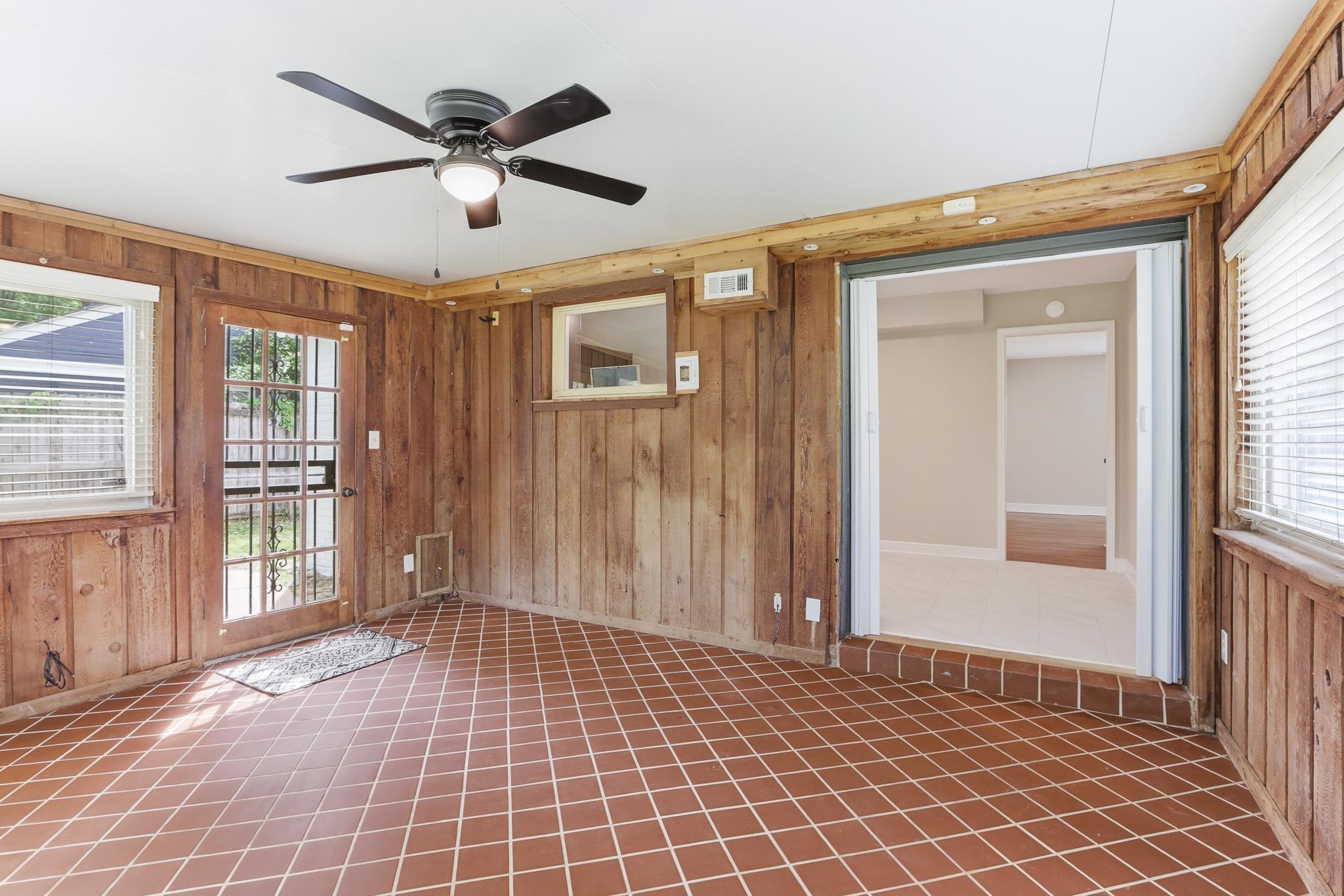 312 Fernway Road Memphis, TN 38117 - Photo 21 of 38 Unfurnished room with plenty of natural light, wooden walls, and ceiling fan
