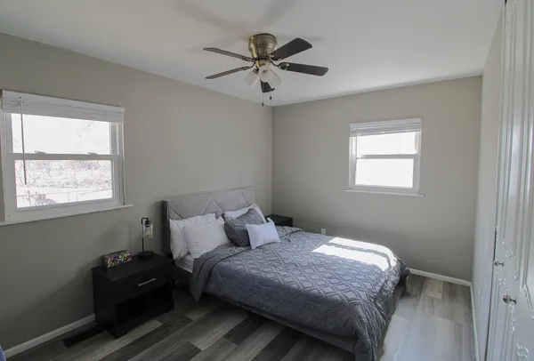 a bedroom with a bed and window