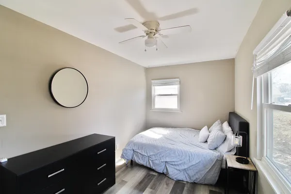 a bedroom with a bed and a window