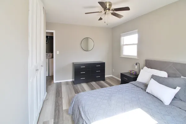 a bedroom with a bed and window