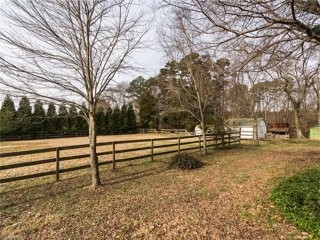 8564 Benbow-Merrill Road Oak Ridge, NC 27310 - Photo 14 of 20 Beautiful pasture land partially fenced with several storage buildings.