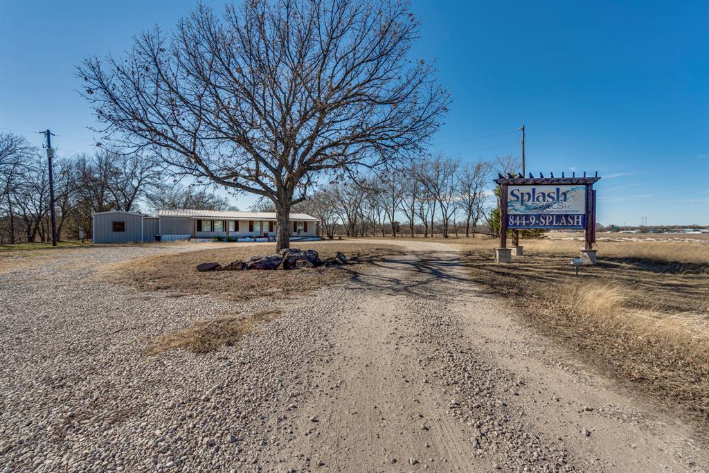 3444 East E Highway Midlothian, TX 76065 - Photo 12 of 26 a view of a yard with a tree
