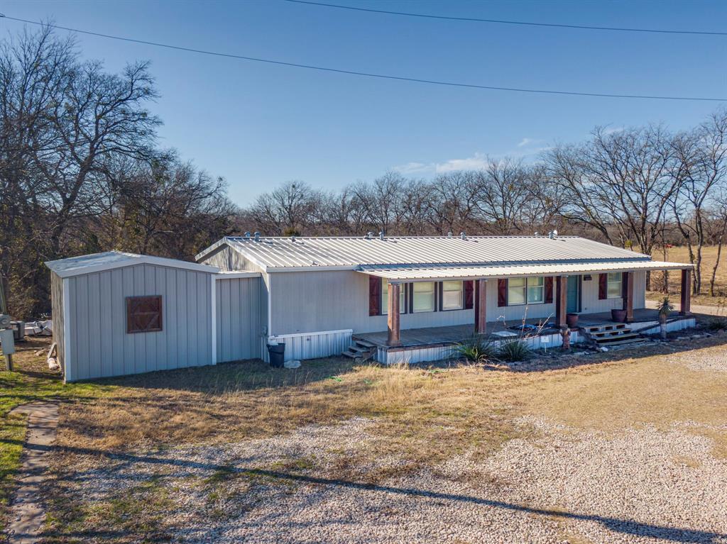 3444 East E Highway Midlothian, TX 76065 - Photo 17 of 26 a view of a house with a yard