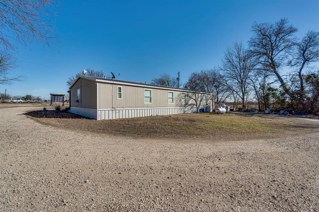 3444 East E Highway Midlothian, TX 76065 - Photo 20 of 26 a view of a house with a yard