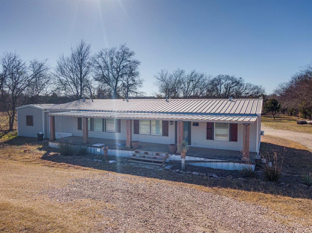 3444 East E Highway Midlothian, TX 76065 - Photo 26 of 26 a front view of a house with yard and large trees
